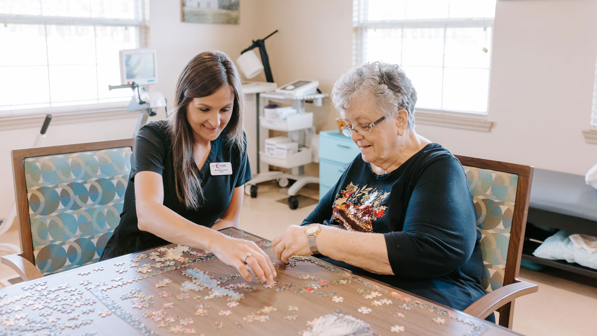 Elder Doing Puzzle at Summit Health and Rehabilitation